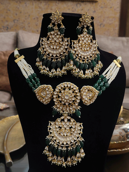 Circular center paachi kundan long center piece choker set with green drops(base metal brass)