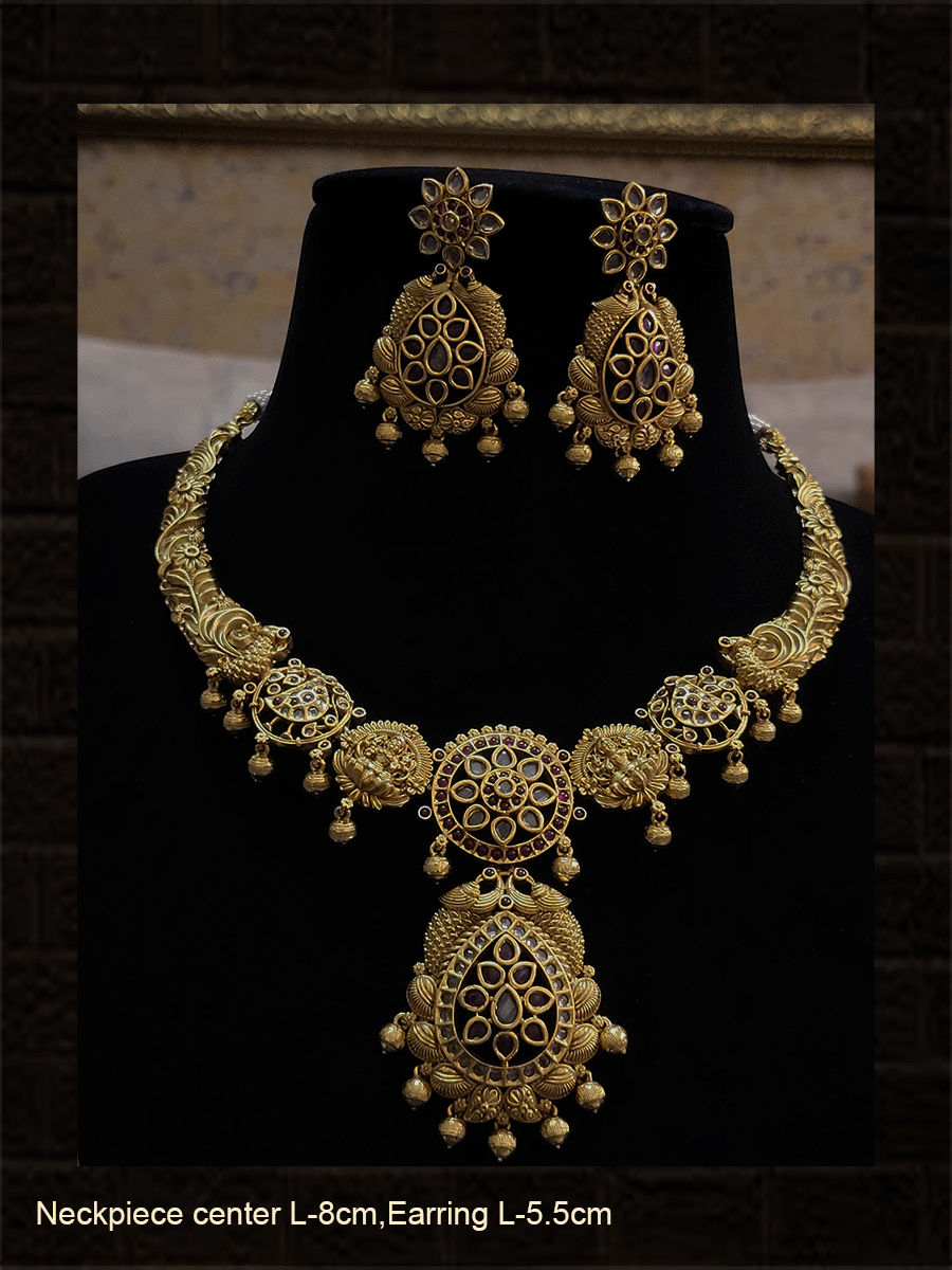 Laxmiji,flower and peacock set studded with polki,ruby and green stones