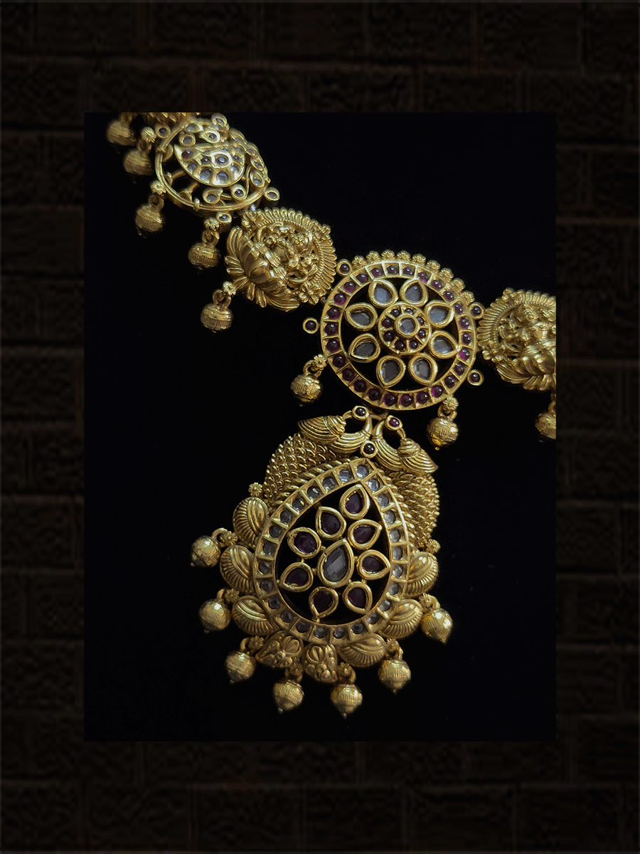 Laxmiji,flower and peacock set studded with polki,ruby and green stones