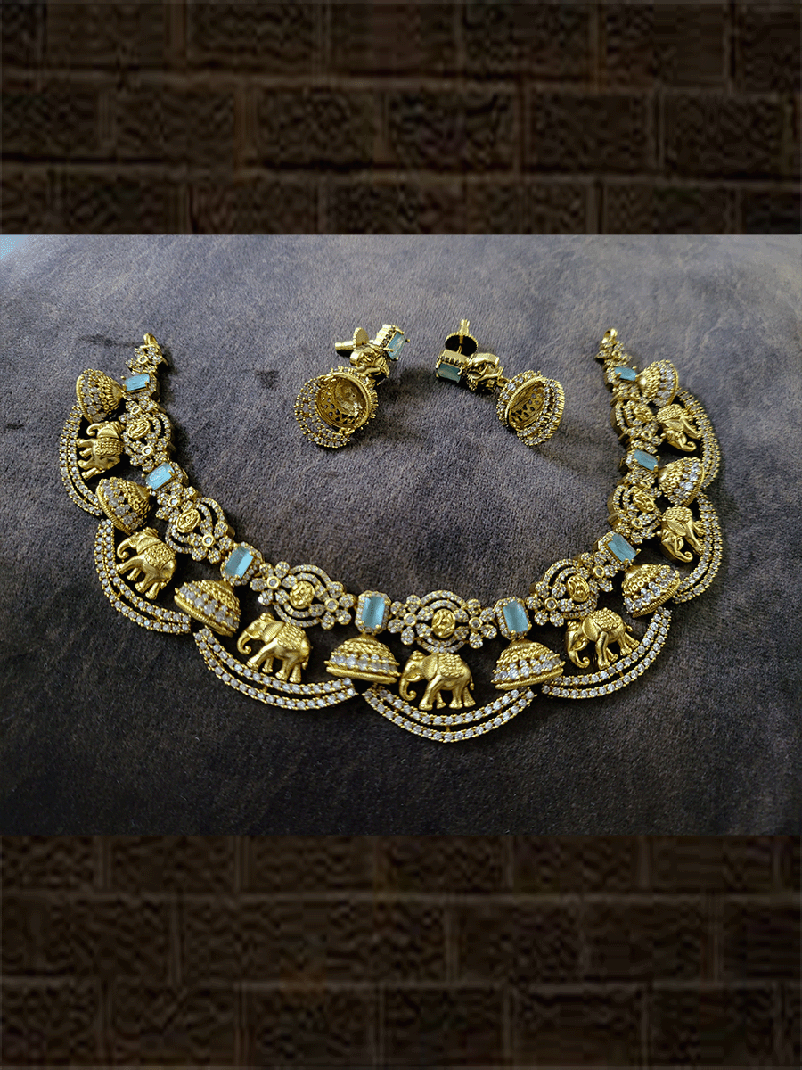 Zircons studded in half jhoomki and elephant design set with rectangular stones - Odara Jewellery