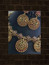 Load image into Gallery viewer, Circular tukdies and flower design polki,ruby and green stones set - Odara Jewellery