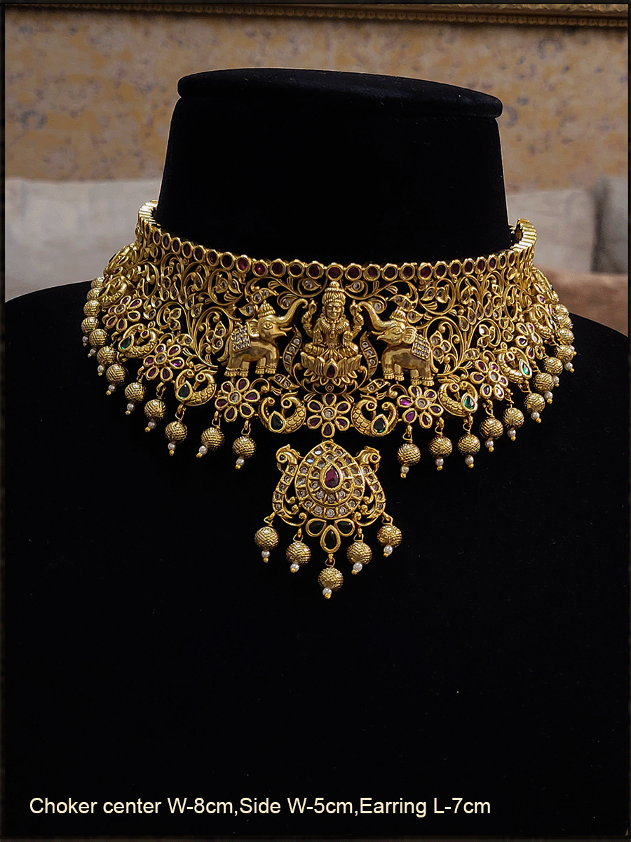 Elephants on sides of laxmiji choker set with flower and peacock design
