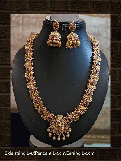 Traditional peacock design long pendant set with ruby and green stones and classy side string - Odara Jewellery