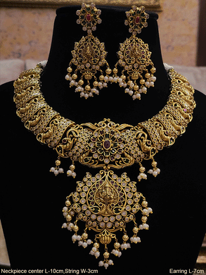 Ganpatiji motif in the center of ruby,polki and green stones set with peacock design side string - Odara Jewellery