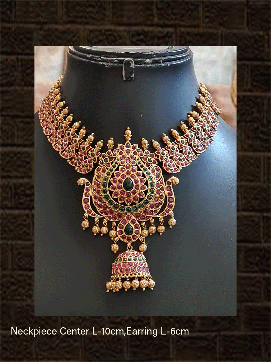 Paisley design side string with ruby and green stones studded pendant with leaf shaped green stones in center - Odara Jewellery