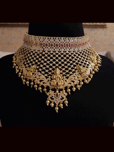 Broad laxmiji motif's choker with zircons embedded on mesh design with gold bead drop's