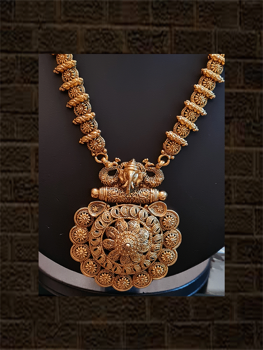 Flower design pendant set with ganpati ji on inverted peacock design long set - Odara Jewellery