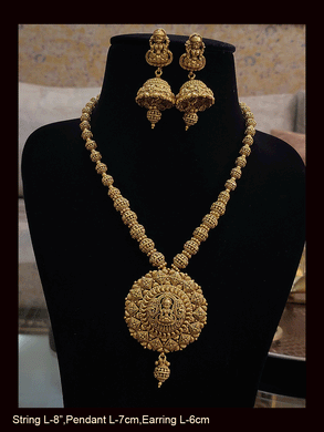 Intricate design laxmiji motif pendant set in matar bead string with jhoomkies