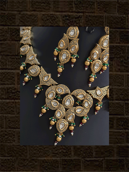 Gold finish antique look kundan set with green bead detailing(Maangtika included) - Odara Jewellery