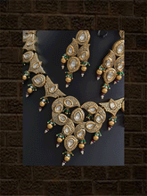Load image into Gallery viewer, Gold finish antique look kundan set with green bead detailing(Maangtika included) - Odara Jewellery