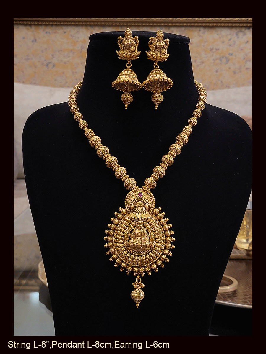 Leaf shaped pendant set with Laxmiji motif in matar bead string