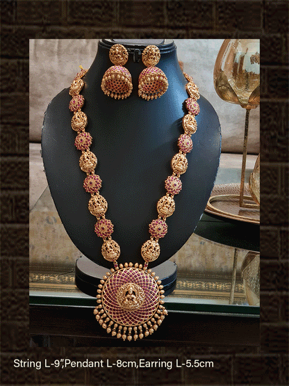 Round ruby stone studded laxmiji motif pendant long set with flower and laxmiji design side chain - Odara Jewellery
