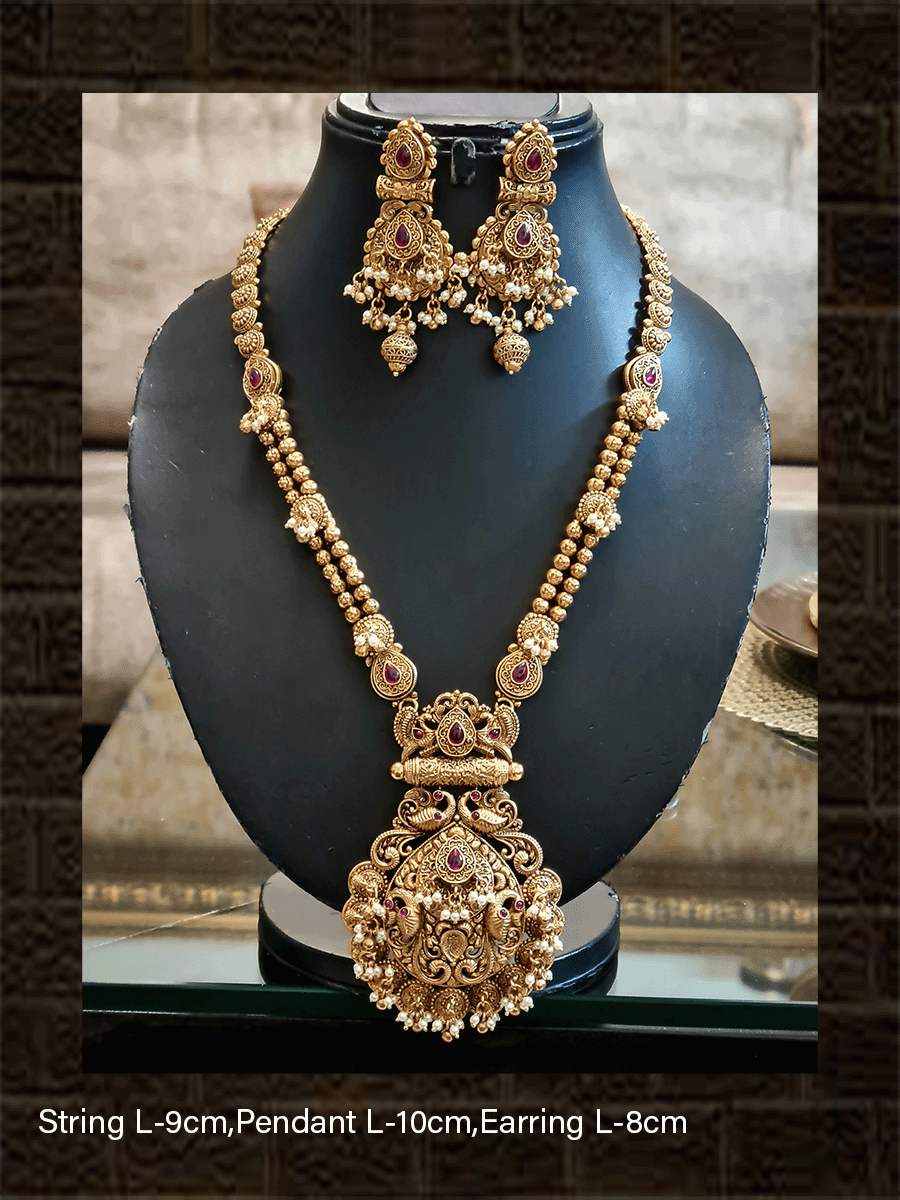 Leaf design pendant with peacock design and ghunghru hangings long set with flowers engraved double gold bead string - Odara Jewellery