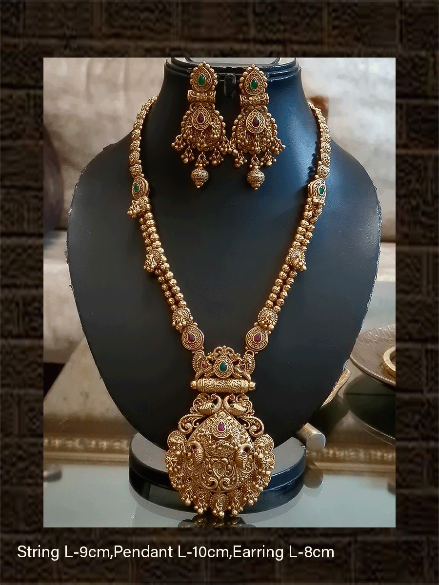 Leaf design pendant with peacock design and ghunghru hangings long set with flowers engraved double gold bead string - Odara Jewellery