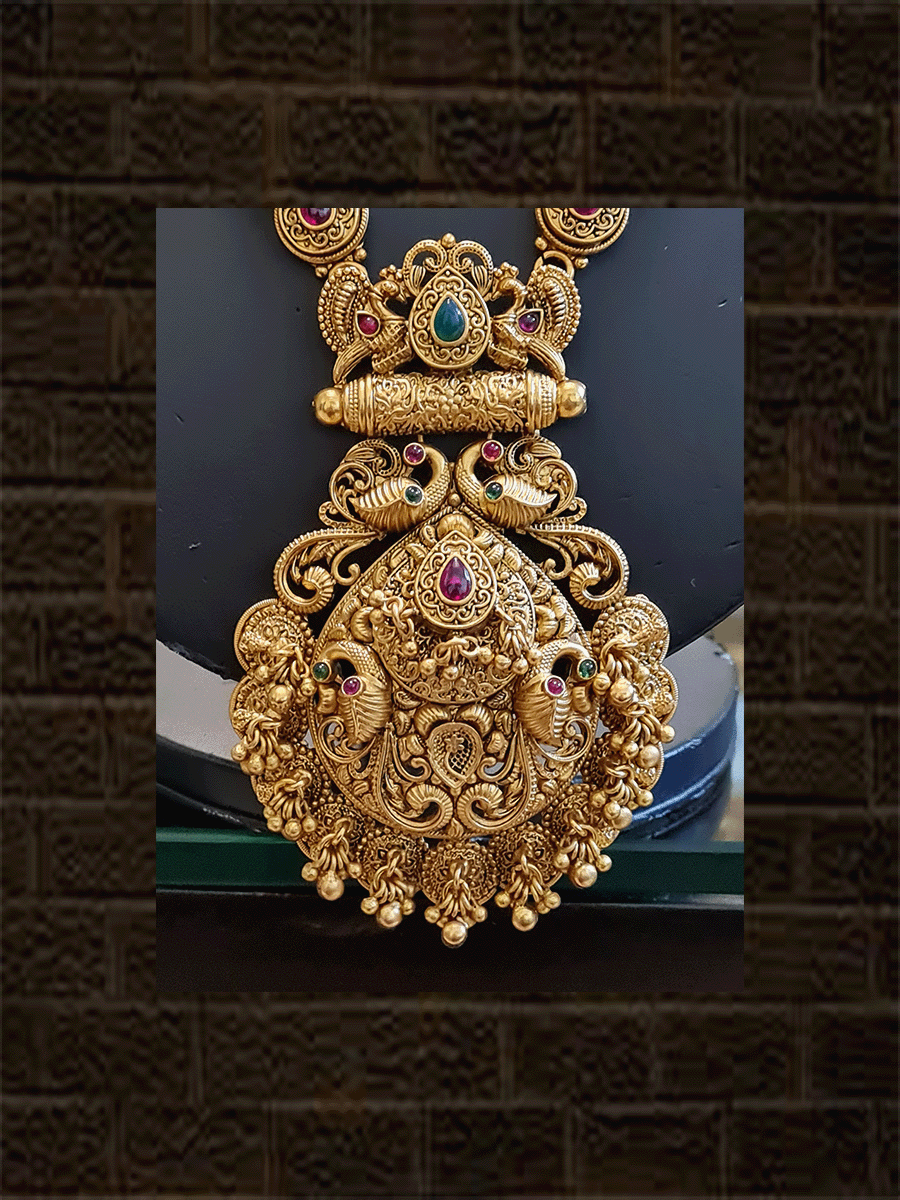 Leaf design pendant with peacock design and ghunghru hangings long set with flowers engraved double gold bead string - Odara Jewellery