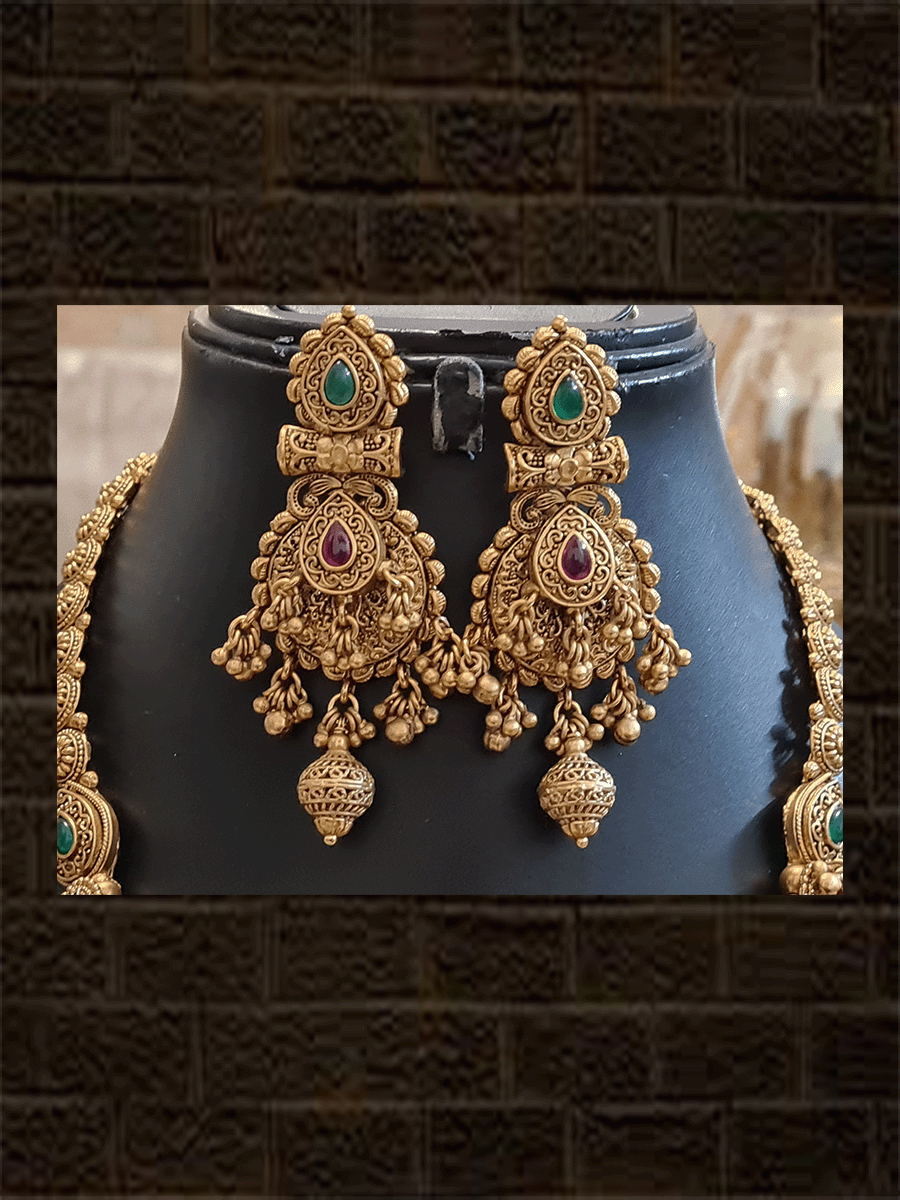 Leaf design pendant with peacock design and ghunghru hangings long set with flowers engraved double gold bead string - Odara Jewellery