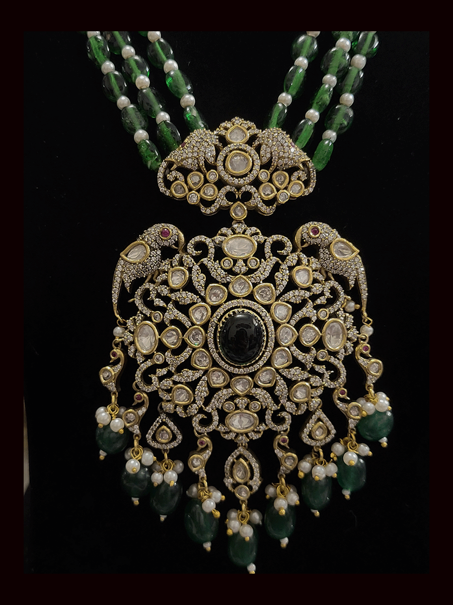 Three beaded 9 inch long strings zircons and kundan studded pendant set with parrot motifs on sides