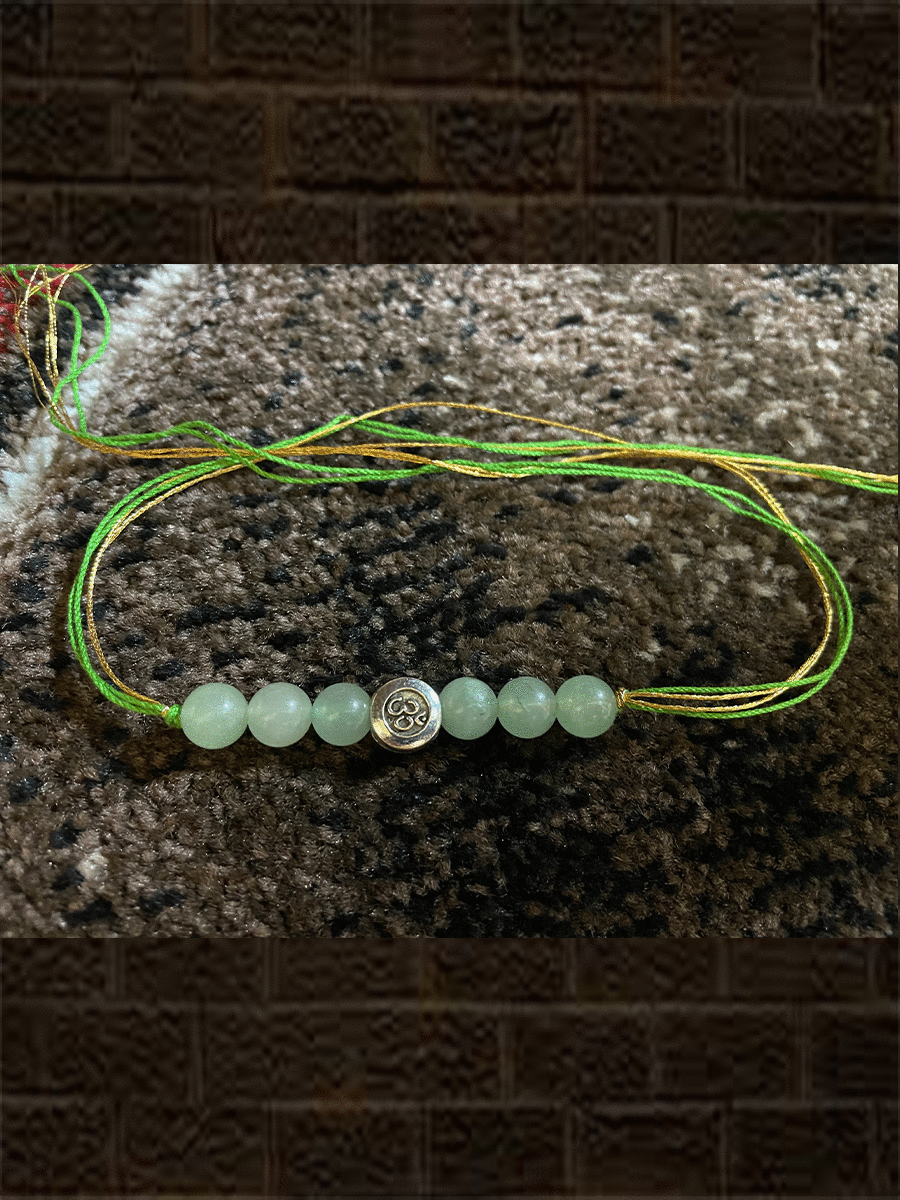 Silver finish Om bead with six shaded beads classy dori rakhi - Odara Jewellery