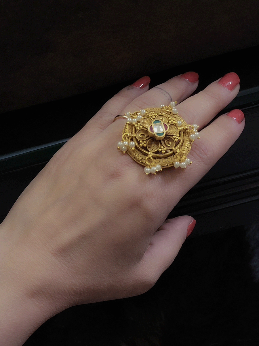 Intricate design circular pearly hanging ring with ruby,green and kundan flower center