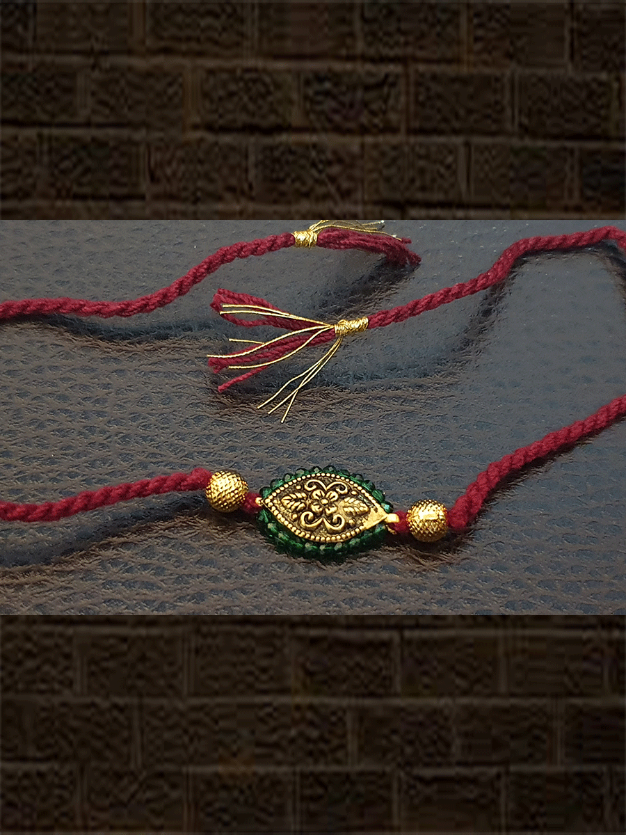 Antique tukdi with green pirohi maroon thread rakhi – Odara Jewellery