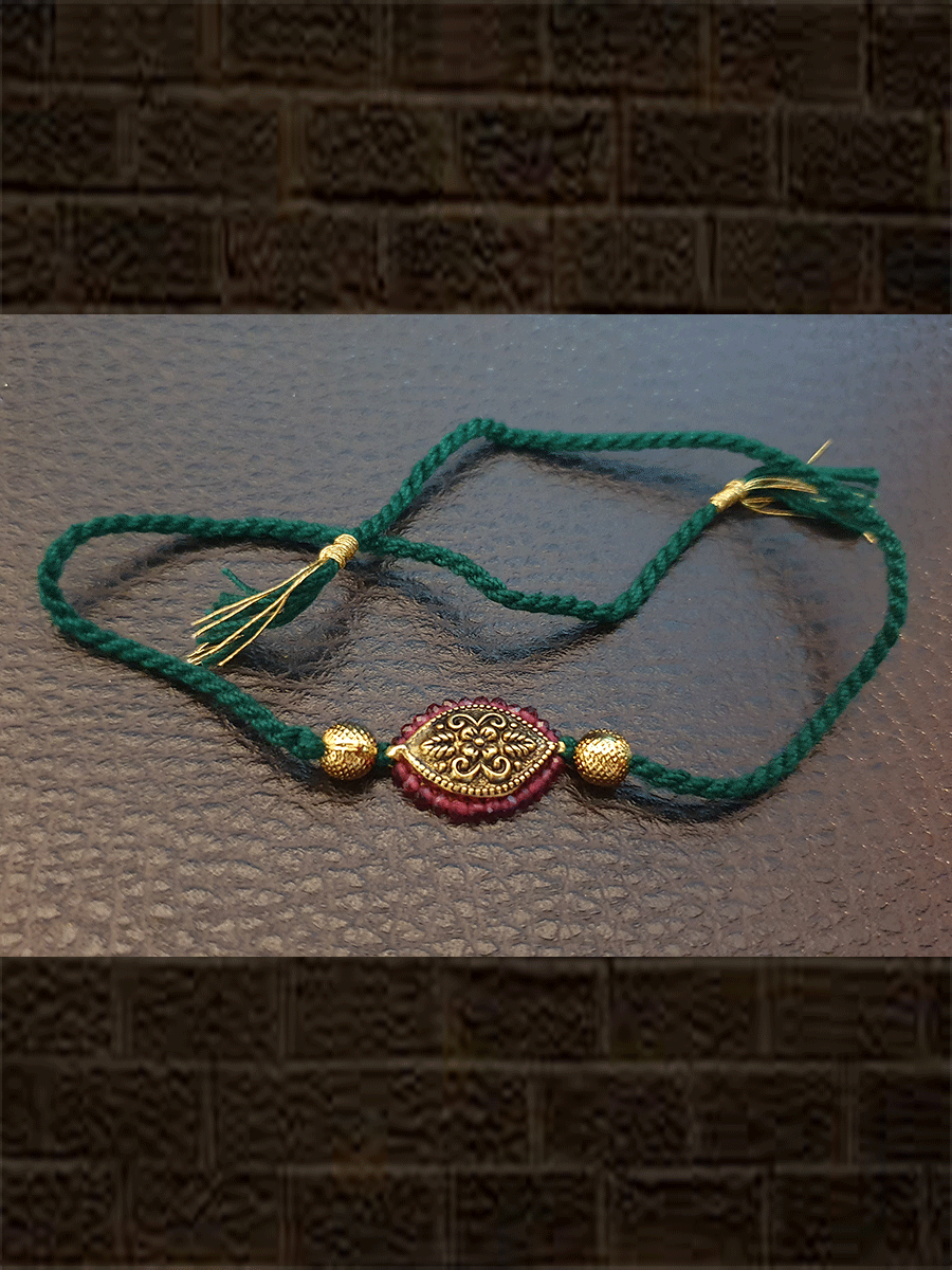 Antique tukdi with ruby pirohi green thread rakhi - Odara Jewellery