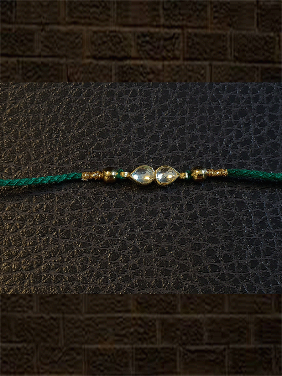 Two leaf Kundan rakhi with gold bead on sides rakhi - Odara Jewellery