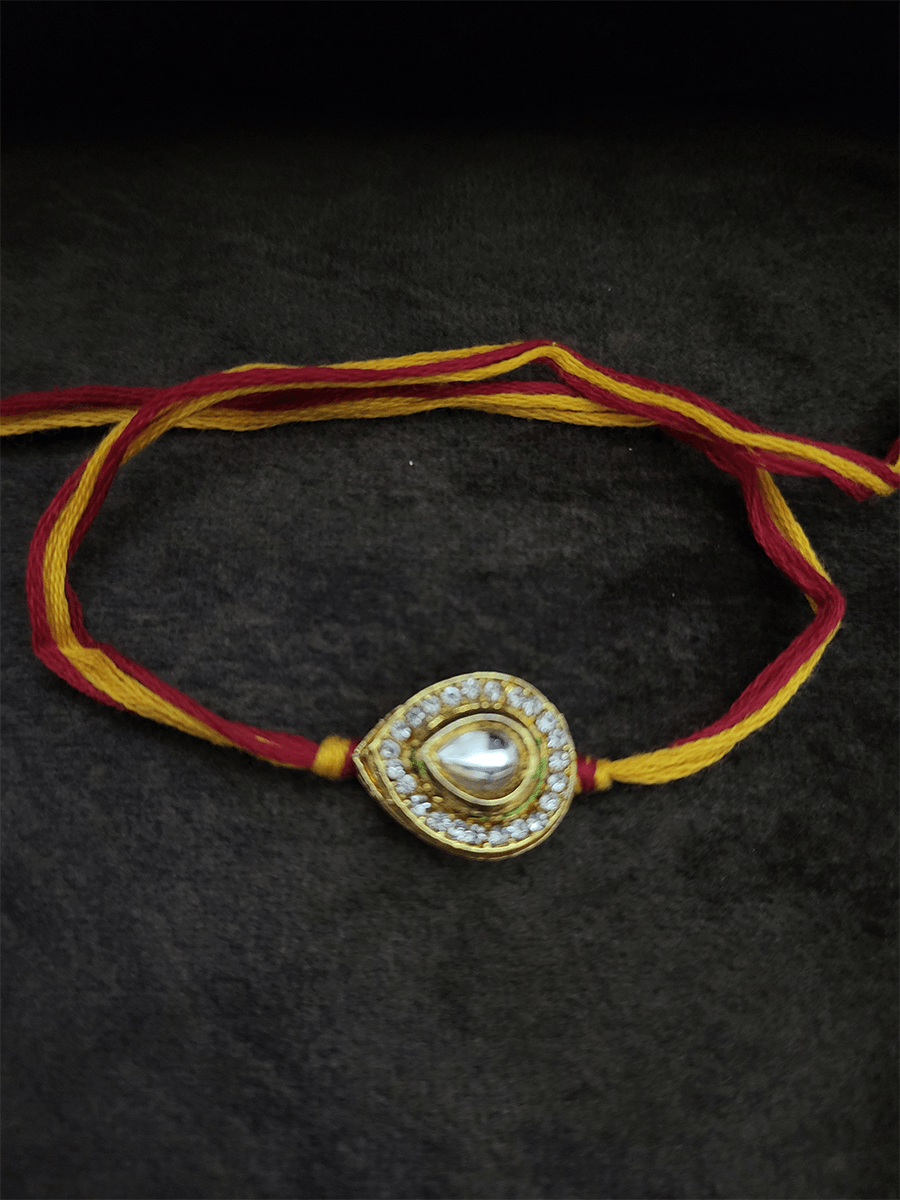 Leaf design kundan rakhi surrounded with AD - Odara Jewellery