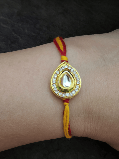 Leaf design kundan rakhi surrounded with AD - Odara Jewellery