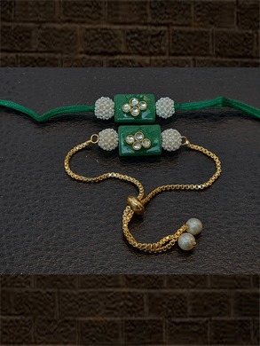Rectangular green stone kundan bhai bhabhi rakhi with pearl beads - Odara Jewellery