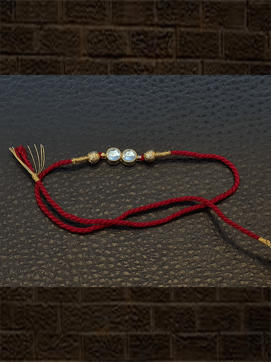 Two round kundan with side gold bead rakhi - Odara Jewellery