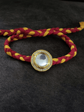 Load image into Gallery viewer, Round bold polki with AD line rakhi in mouli - Odara Jewellery