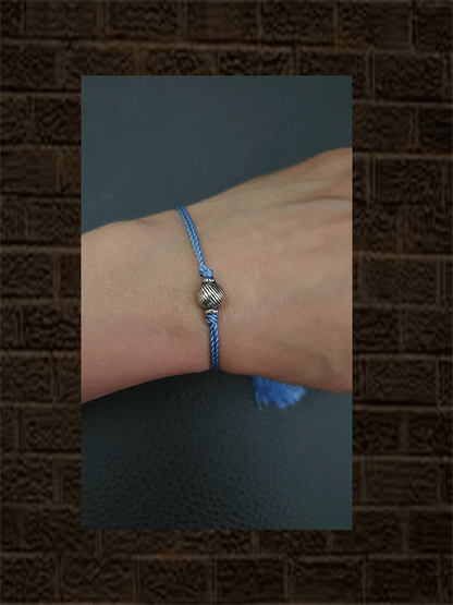 Sterling silver self design round bead rakhi in blue thread - Odara Jewellery