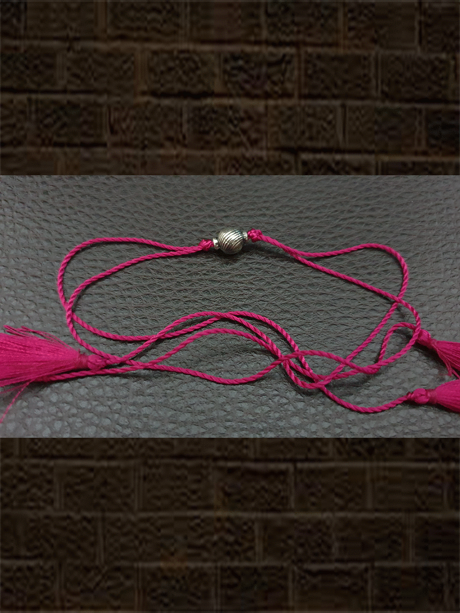 Sterling silver self design round bead rakhi in magenta thread - Odara Jewellery