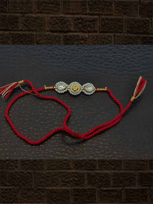 Two kundan's with pirohi work and antique tukdi rakhi in red thread - Odara Jewellery