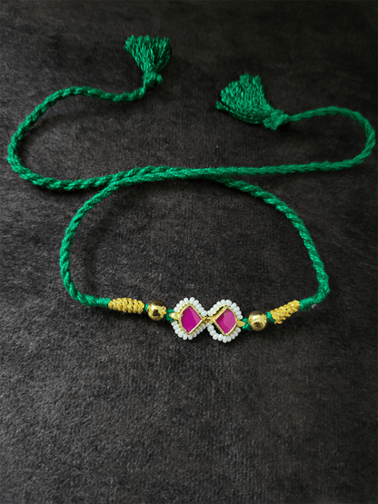 Ruby triangular stones pirohi work green thread rakhi - Odara Jewellery