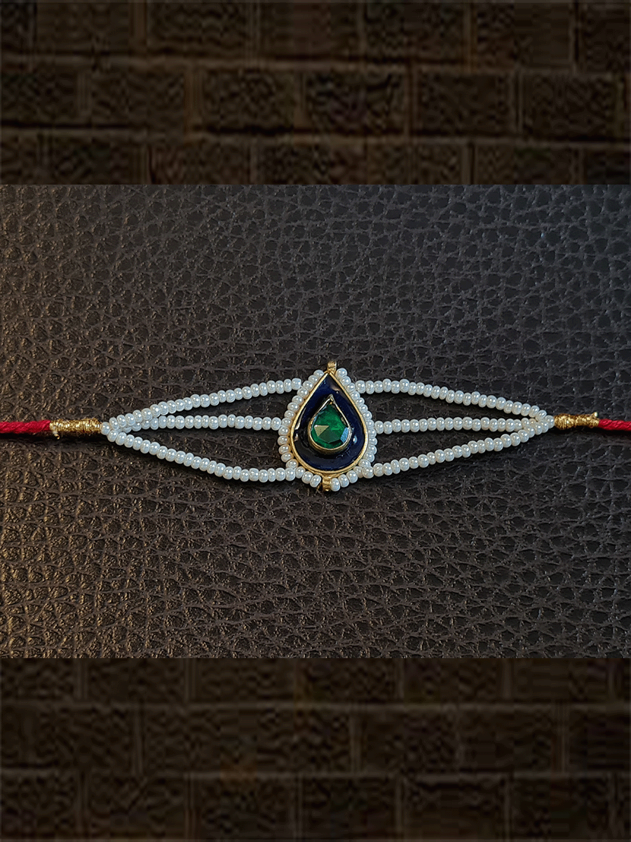 Leaf design enamel work green stone rakhi with pirohi and three cheed string dori - Odara Jewellery
