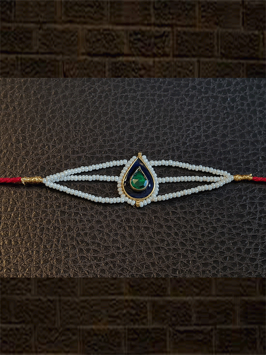 Leaf design enamel work green stone rakhi with pirohi and three cheed string dori - Odara Jewellery