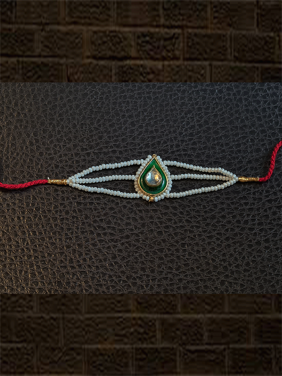 Leaf design enamel work Kundan rakhi with pirohi and three cheed string dori - Odara Jewellery
