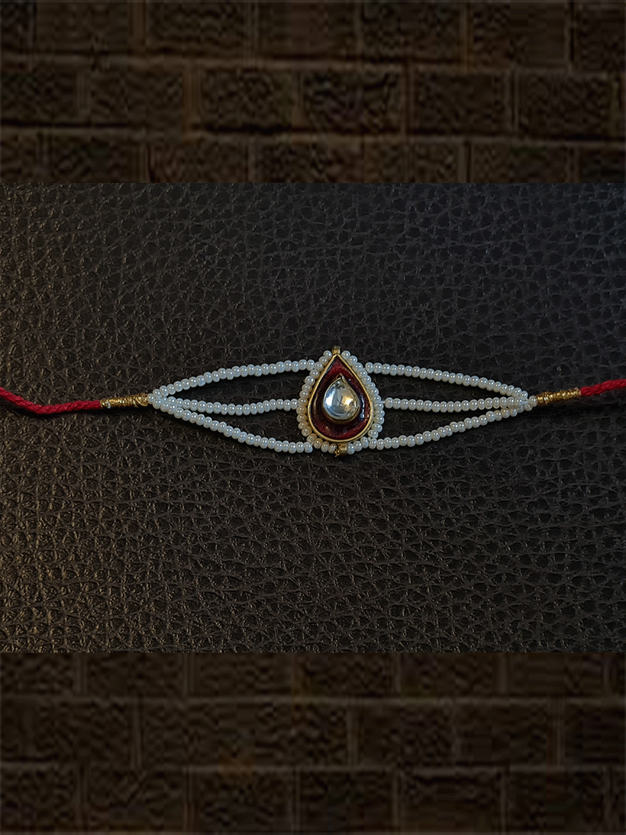 Leaf design enamel work Kundan rakhi with pirohi and three cheed string dori - Odara Jewellery