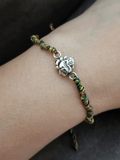 Sterling silver ganpati ji rakhi in multicoloured adjustable thread - Odara Jewellery