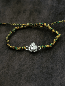 Sterling silver ganpati ji rakhi in multicoloured adjustable thread - Odara Jewellery