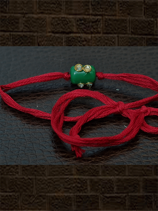 Green bead red thread kundan rakhi - Odara Jewellery