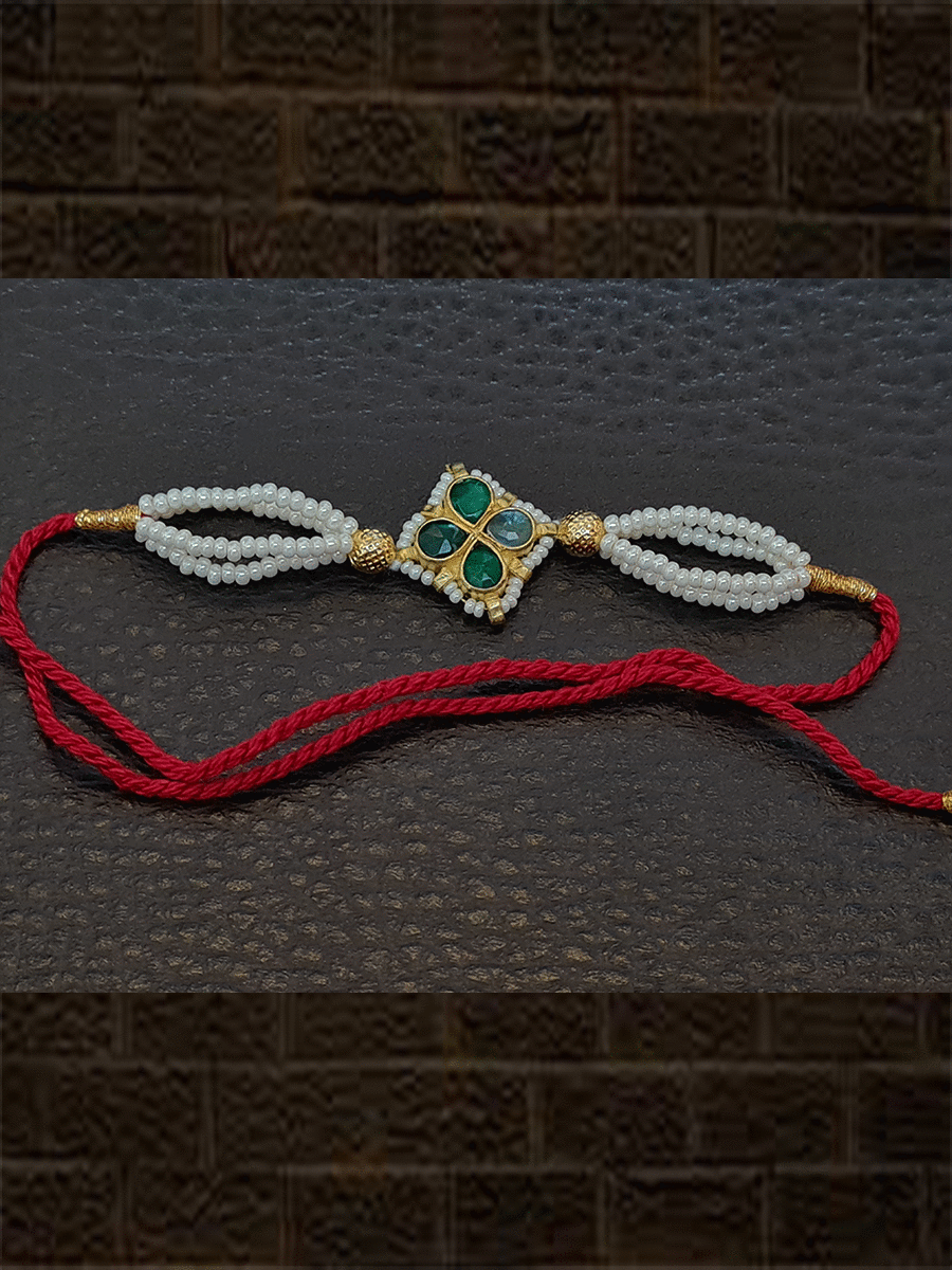 Stones flower with pirohi work and side three cheed strings rakhi - Odara Jewellery