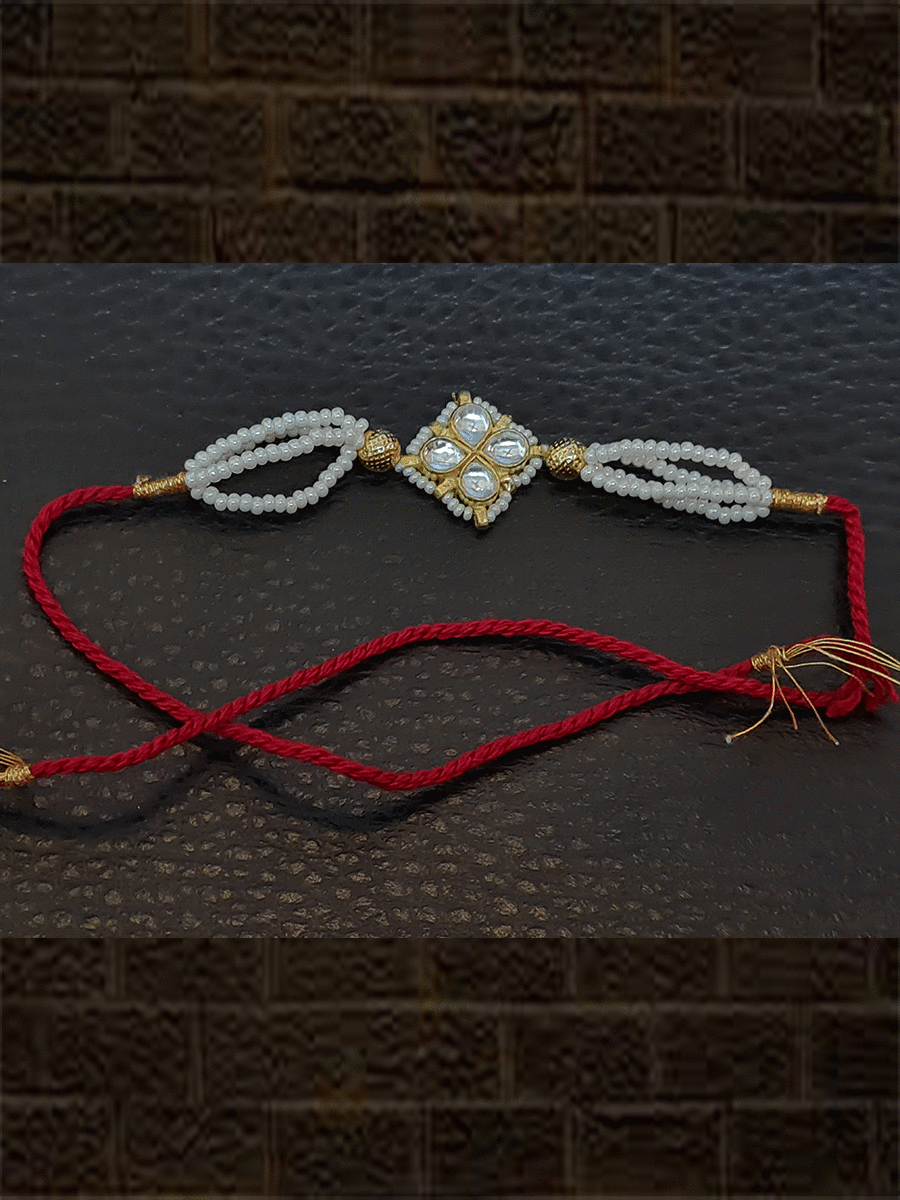 Kundan flower with pirohi work and side three cheed strings rakhi - Odara Jewellery