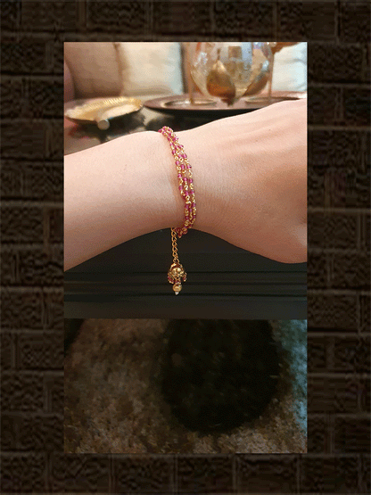 Three ruby string bhabhi rakhi with hanging jhoomki - Odara Jewellery