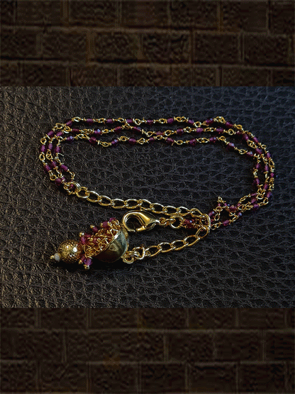 Three ruby string bhabhi rakhi with hanging jhoomki - Odara Jewellery