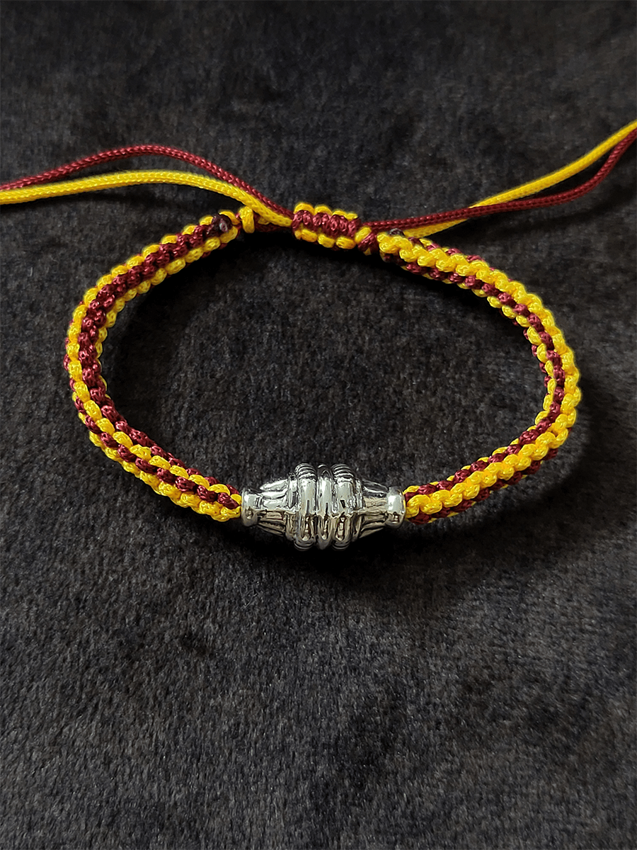 Sterling silver rakhi in adjustable yellow and maroon thread - Odara Jewellery