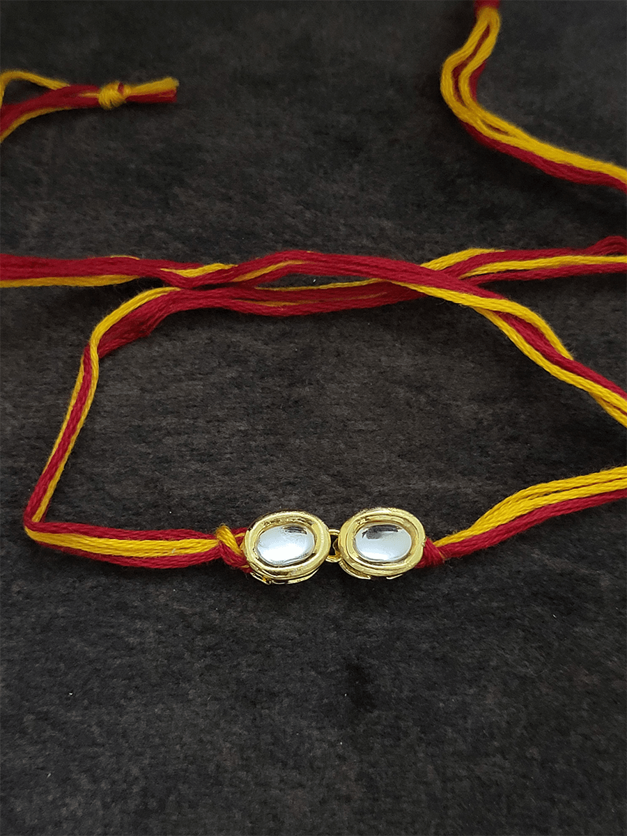 Two oval kundan mouli rakhi - Odara Jewellery