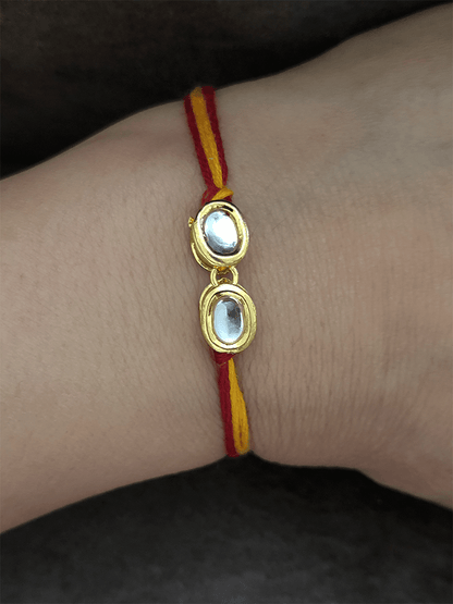 Two oval kundan mouli rakhi - Odara Jewellery