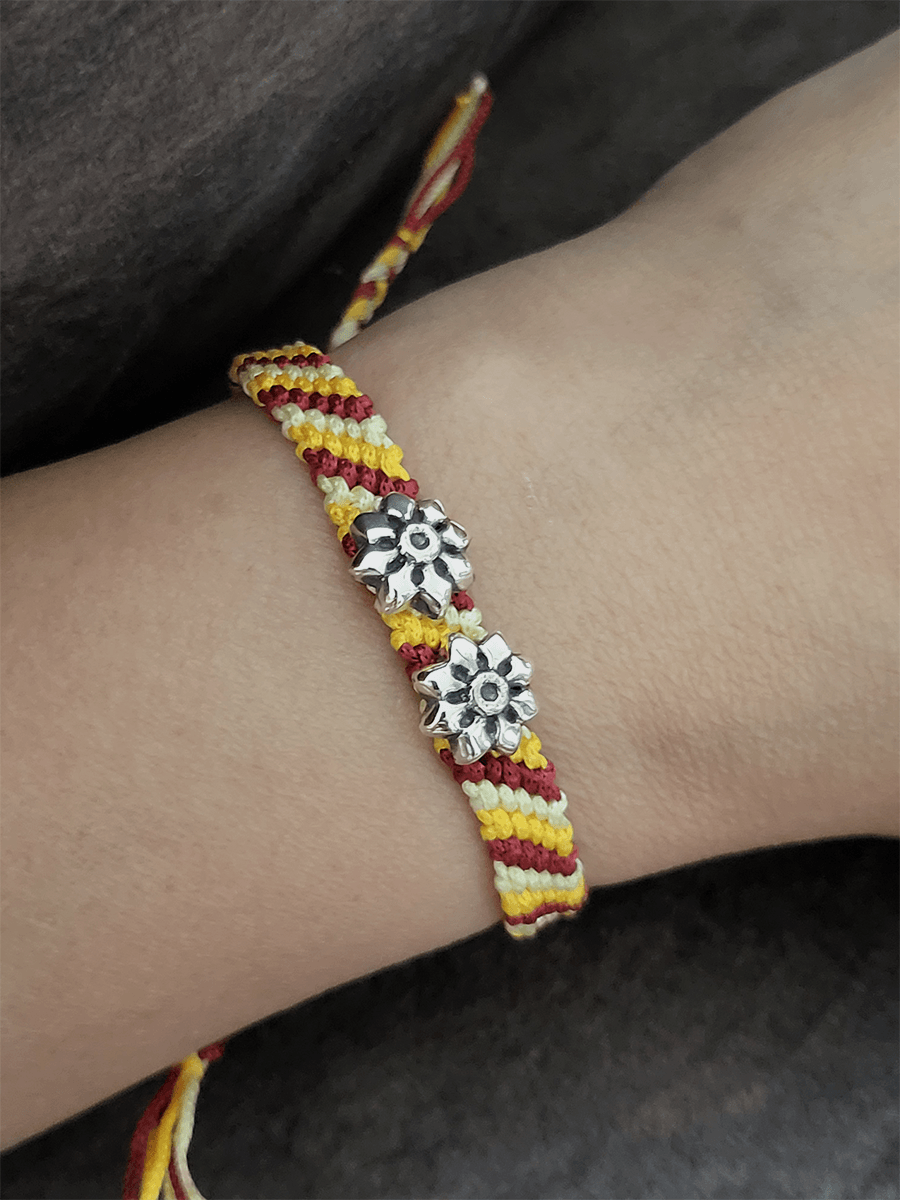 Sterling silver two oxidised flower on red,yellow and white pull-on thread rakhi - Odara Jewellery